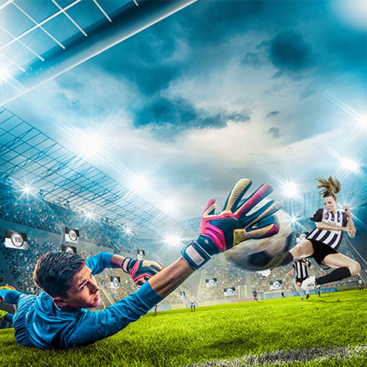 Motivationsprojekt Fußball - KickStart Ein Fußballer macht einen Hechtsprung nach dem Ball.